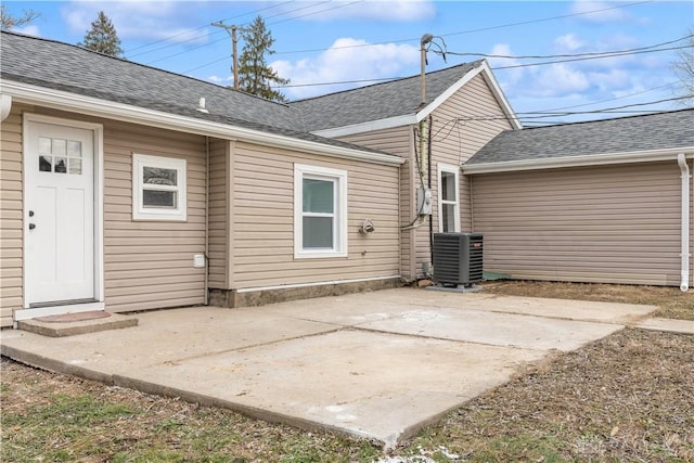 rear view of house featuring a patio area and central air condition unit