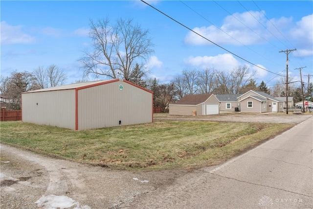 view of property exterior with a garage and a yard