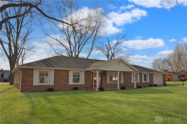 ranch-style home featuring a garage and a front lawn