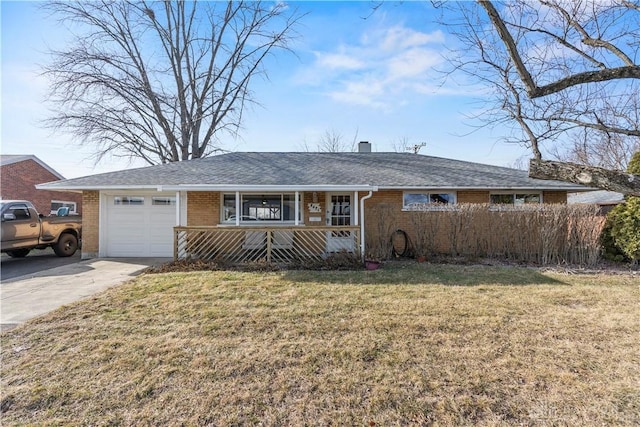 ranch-style home featuring a garage and a front lawn