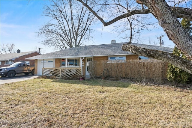 ranch-style home with a front lawn