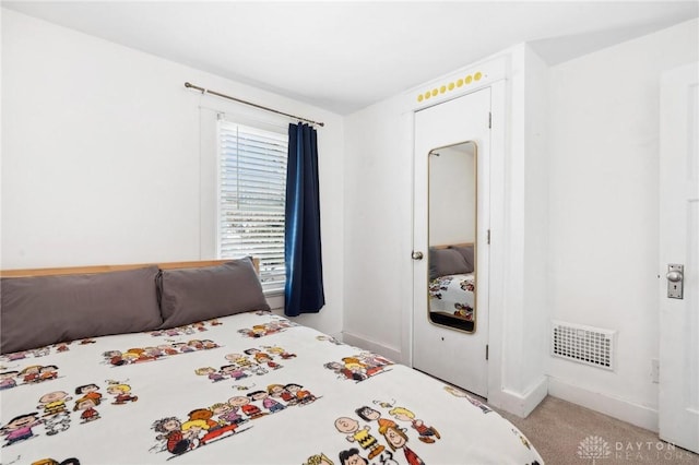 bedroom with light colored carpet