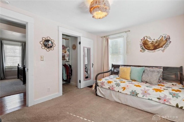 carpeted bedroom featuring a spacious closet