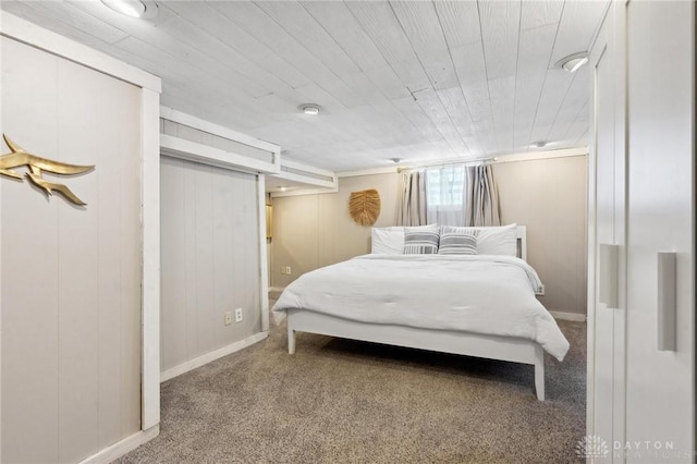 bedroom featuring carpet and wood ceiling