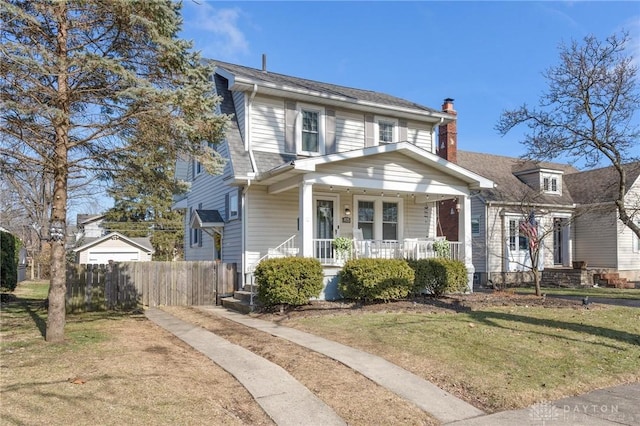 view of front of property with a front lawn and covered porch