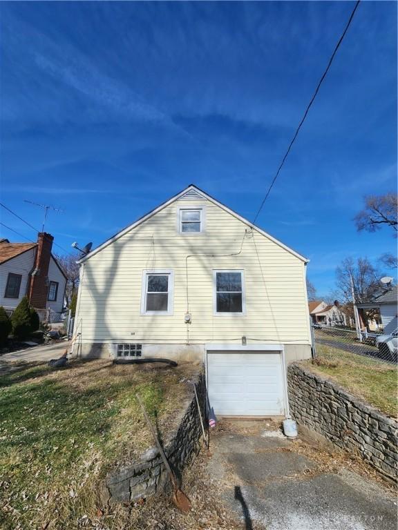 view of side of property with a garage