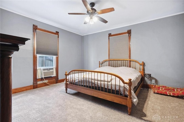 bedroom with ornamental molding, carpet floors, cooling unit, and ceiling fan