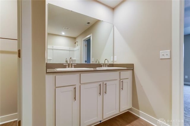 bathroom featuring vanity and hardwood / wood-style floors