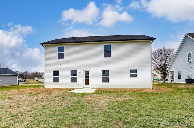 rear view of house with a lawn