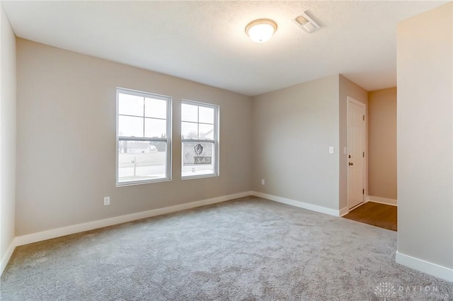 empty room with light colored carpet