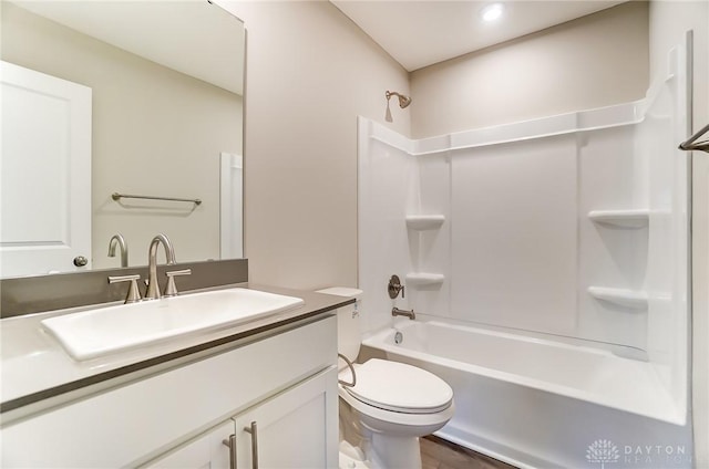 full bathroom with vanity, shower / bathtub combination, and toilet