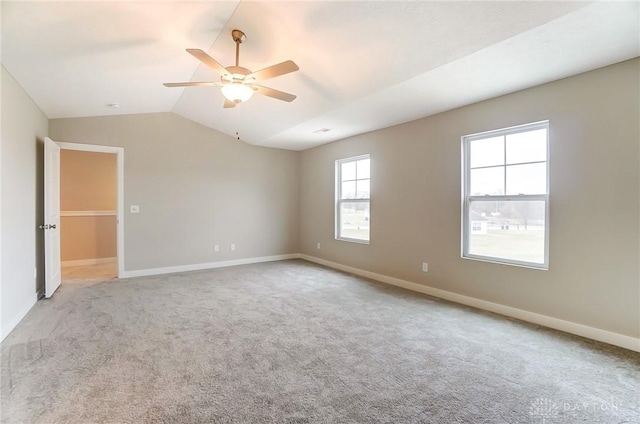 carpeted empty room with lofted ceiling and ceiling fan