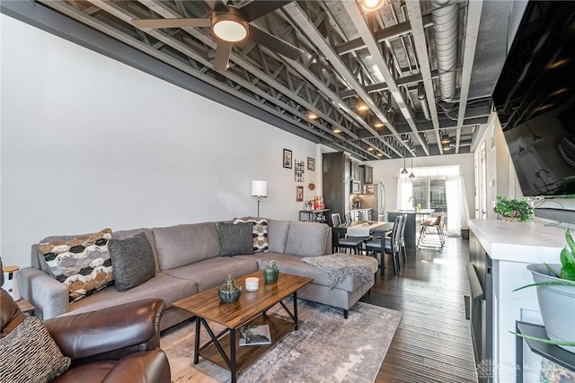 living room featuring hardwood / wood-style flooring and ceiling fan