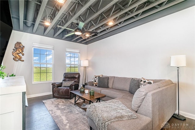 living room featuring dark hardwood / wood-style flooring and ceiling fan