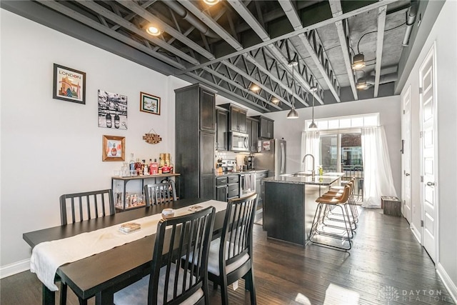 dining room featuring dark hardwood / wood-style flooring and sink