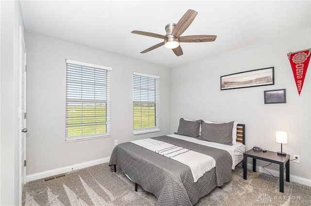 bedroom featuring ceiling fan and carpet