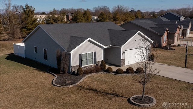 view of front of property with a garage and a front yard