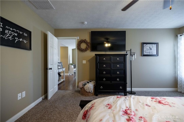 carpeted bedroom featuring a textured ceiling