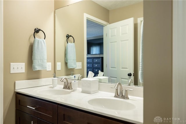 bathroom featuring vanity and a textured ceiling