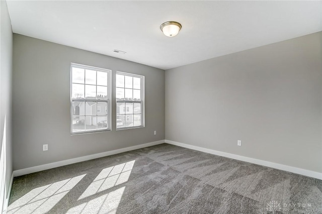 spare room with light colored carpet