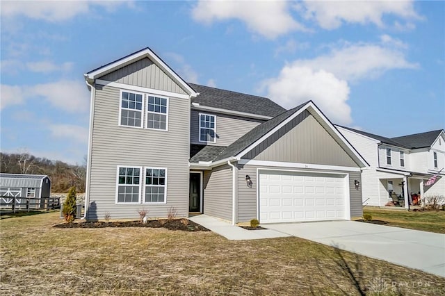 view of front of property with a garage and a front lawn