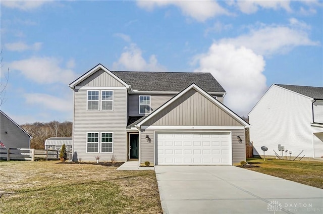 view of front of home featuring a garage and a front lawn