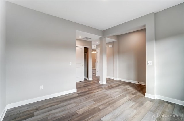 spare room featuring hardwood / wood-style floors