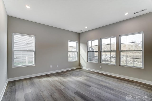 spare room featuring light hardwood / wood-style flooring