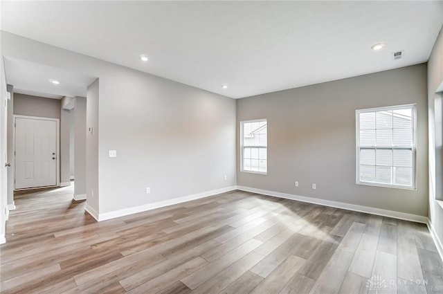 spare room featuring light hardwood / wood-style flooring