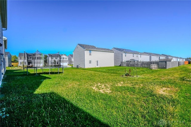 view of yard with a trampoline