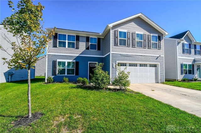 view of front of home with a garage and a front yard