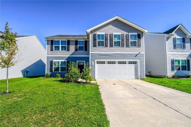 view of front of house with a garage and a front lawn