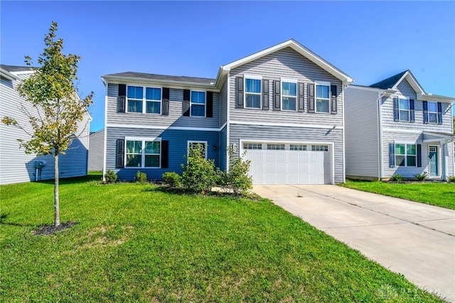 view of front of house featuring a garage and a front lawn