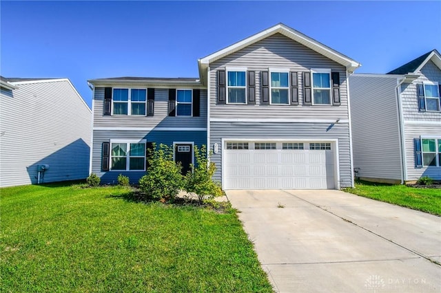 view of front of home with a garage and a front yard