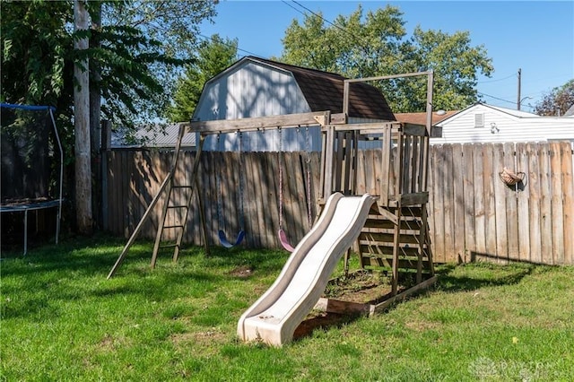 view of jungle gym with a trampoline and a yard