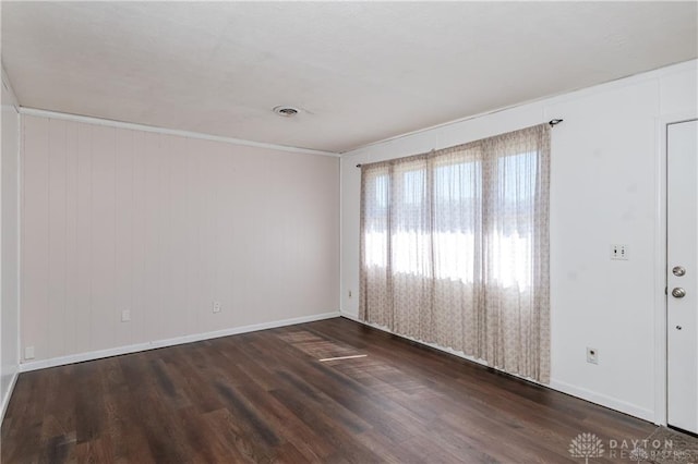 spare room with dark hardwood / wood-style flooring