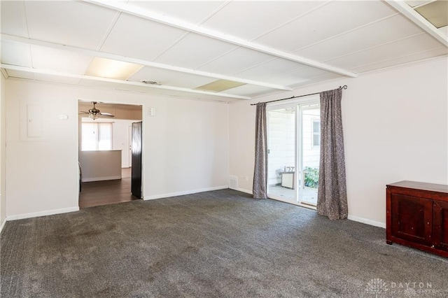 empty room featuring dark carpet and ceiling fan