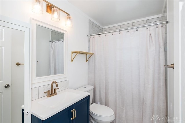 bathroom featuring vanity, a shower with curtain, and toilet