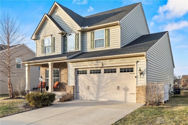 view of front of property featuring a garage and covered porch