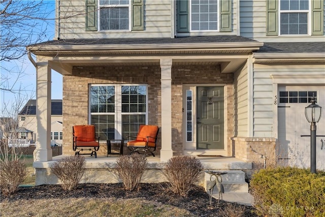 view of exterior entry featuring a porch