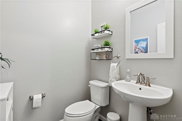 bathroom featuring sink and toilet