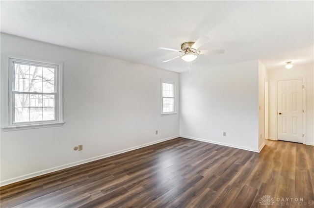 unfurnished room featuring ceiling fan and dark hardwood / wood-style floors