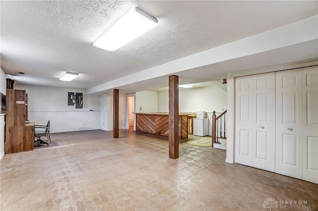 basement with a textured ceiling