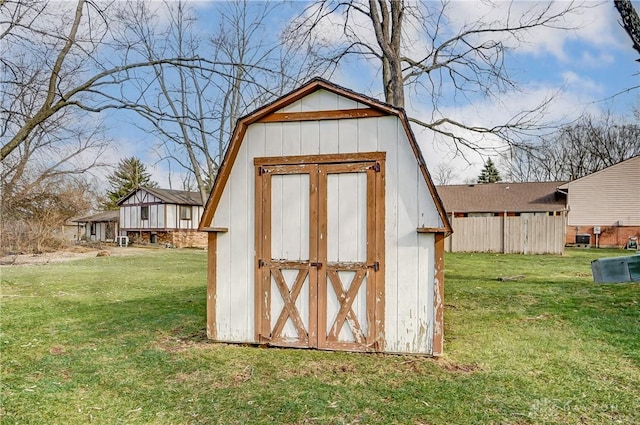 view of outdoor structure featuring a lawn