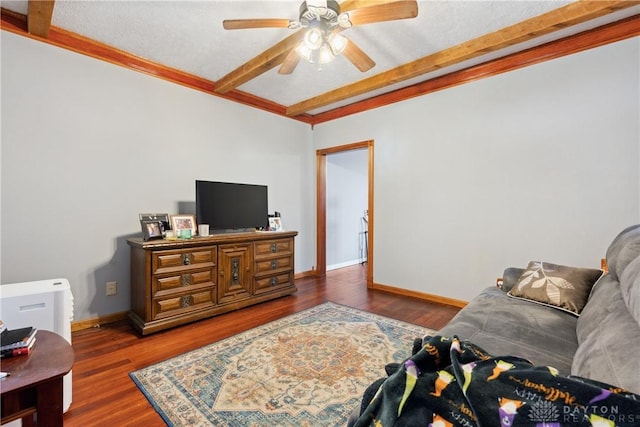 living room featuring beamed ceiling, ceiling fan, and dark hardwood / wood-style floors