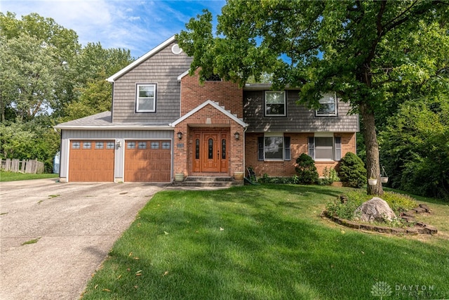 view of front of property with concrete driveway, a front yard, brick siding, and a garage