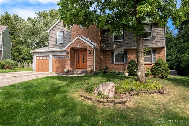 view of front of property with central AC, a garage, and a front yard