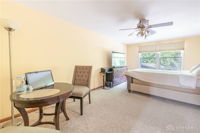 bedroom featuring light colored carpet and ceiling fan