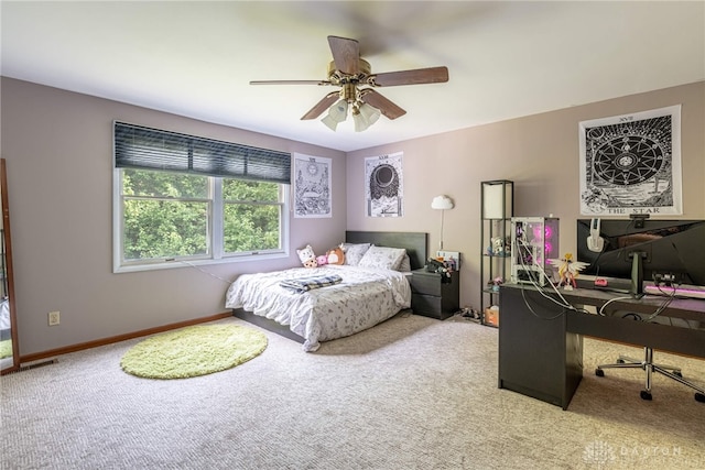 bedroom featuring carpet, a desk, ceiling fan, and baseboards