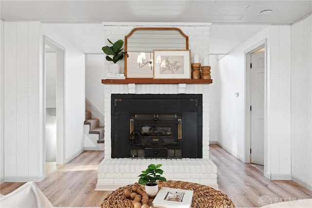 interior details with hardwood / wood-style floors and wood walls